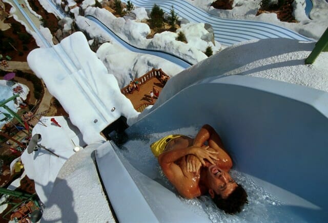 Thrilling view of man on waterslide